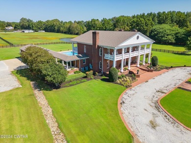 Nestled on 10 breathtaking acres just outside Jackson, this