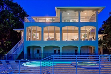 This meticulously refined Gulf-front estate embodies the essence