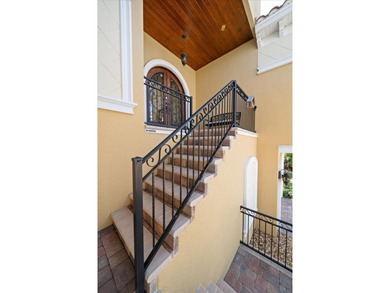 Nestled in the highly coveted Harbor Bluffs community, this