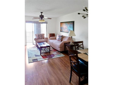 Enjoy stunning golf course and lake views from this bright