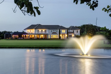 Nestled within the prestigious gated enclave of Palm Beach Point