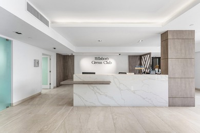 This unique first-floor condominium offers the scale and