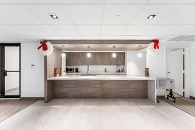 This unique first-floor condominium offers the scale and