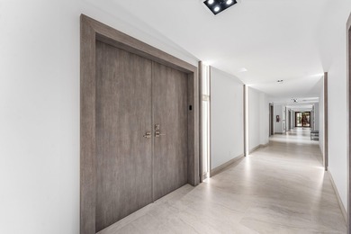 This unique first-floor condominium offers the scale and