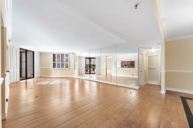 This unique first-floor condominium offers the scale and