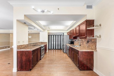 This unique first-floor condominium offers the scale and