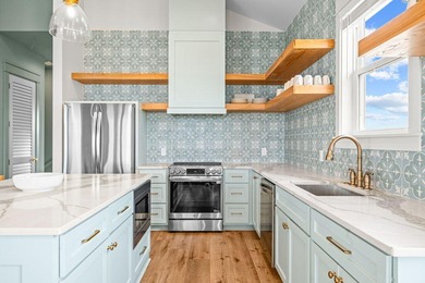 Motivated Seller! This 5 BR, 4 baths coastal home by Ben Wortman