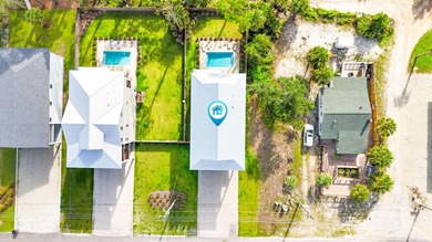 Motivated Seller! This 5 BR, 4 baths coastal home by Ben Wortman