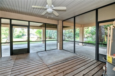 Nestled at the end of a quiet street on a wooded property along