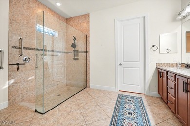 Welcome to this beautifully designed WCI-built 4-bedroom, 3-bath