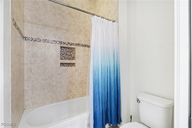 Welcome to this beautifully designed WCI-built 4-bedroom, 3-bath