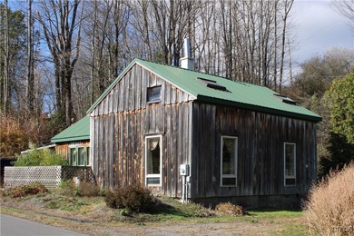 On these beautiful 2.3 acres sits a charming and cozy lofted