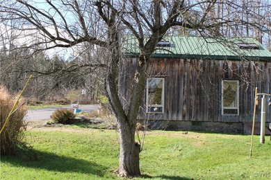 On these beautiful 2.3 acres sits a charming and cozy lofted