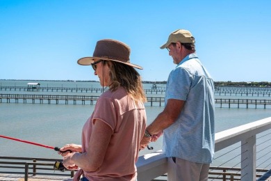 Tucked behind the gates of Sea Shell Shores, lies a home of