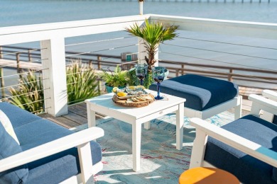 Tucked behind the gates of Sea Shell Shores, lies a home of