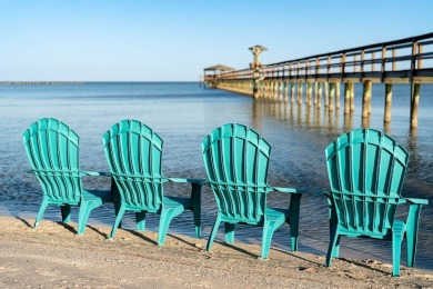 Tucked behind the gates of Sea Shell Shores, lies a home of