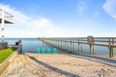 Tucked behind the gates of Sea Shell Shores, lies a home of