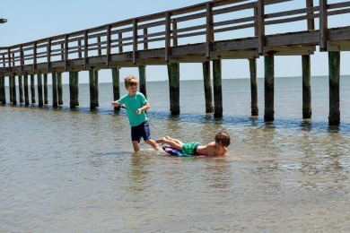 Tucked behind the gates of Sea Shell Shores, lies a home of