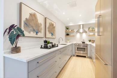 Experience breathtaking water views from this fully renovated