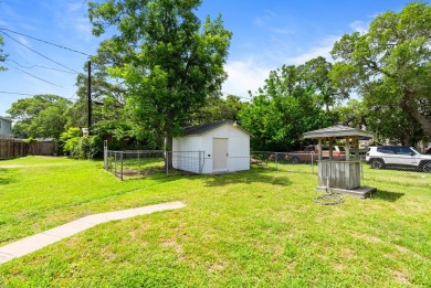 This charming three-bedroom, one-bathroom home sits proudly on a
