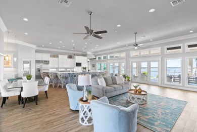 This extraordinary waterfront estate spans over 4,300 sq. ft. of