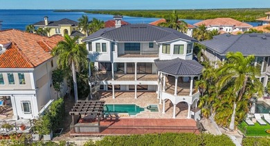 Experience this sleek, modernized Mediterranean masterpiece in