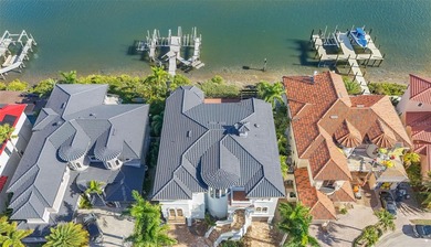 Experience this sleek, modernized Mediterranean masterpiece in