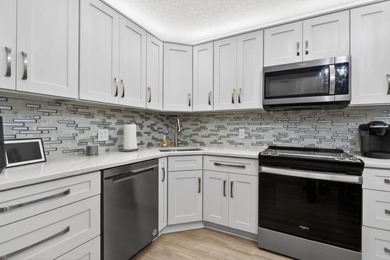 Magnificently renovated 3 bedroom, 2 full bath, 2nd floor condo