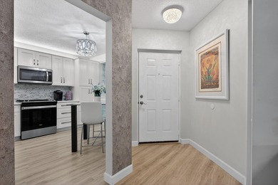 Magnificently renovated 3 bedroom, 2 full bath, 2nd floor condo