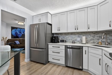 Magnificently renovated 3 bedroom, 2 full bath, 2nd floor condo
