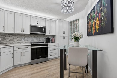 Magnificently renovated 3 bedroom, 2 full bath, 2nd floor condo