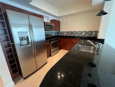 This spacious residence offers an open-concept living and dining