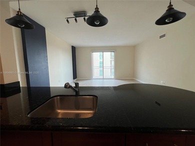 This spacious residence offers an open-concept living and dining