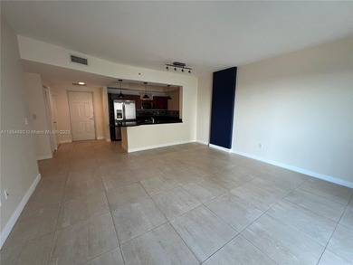 This spacious residence offers an open-concept living and dining