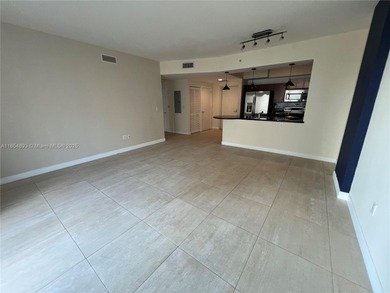 This spacious residence offers an open-concept living and dining