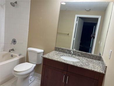 This spacious residence offers an open-concept living and dining