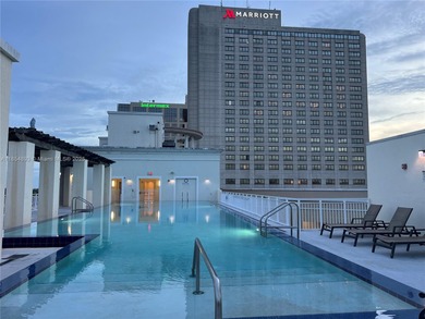 This spacious residence offers an open-concept living and dining