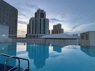 This spacious residence offers an open-concept living and dining