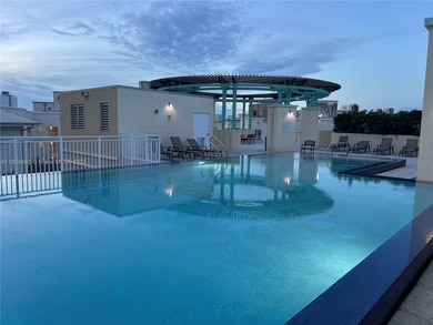 This spacious residence offers an open-concept living and dining