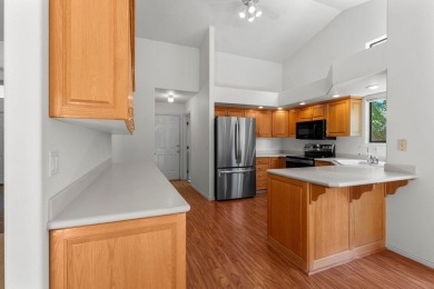 Open and airy with soaring vaulted ceilings throughout! Kitchen