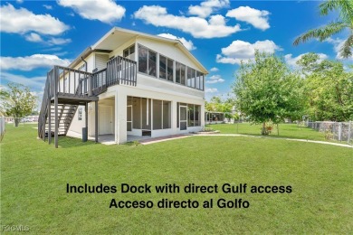 **SHORT SALE!** Light-filled corner home on the Caloosahatchee