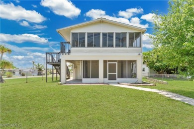 **SHORT SALE!** Light-filled corner home on the Caloosahatchee