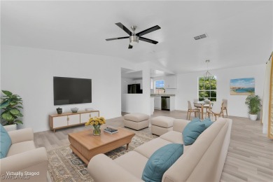 **SHORT SALE!** Light-filled corner home on the Caloosahatchee