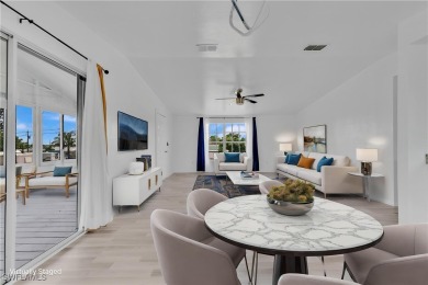 **SHORT SALE!** Light-filled corner home on the Caloosahatchee