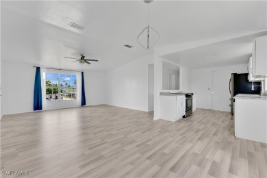 **SHORT SALE!** Light-filled corner home on the Caloosahatchee