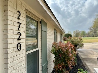 Situated on an expansive double lot near Muskogee Golf Club