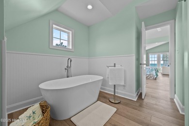 This exquisite, fully furnished oceanfront home in the coveted