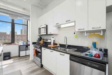 Discover this rare southeast corner unit in the 2003-built