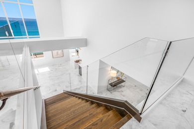 Experience modern coastal luxury in this one-of-a-kind 4-bedroom