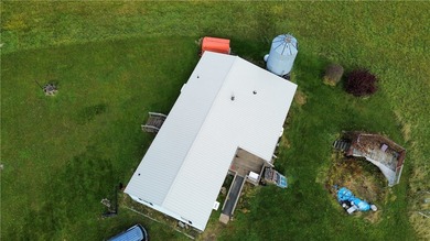 21 acres, partially wooded, a scenic pond, large back deck to